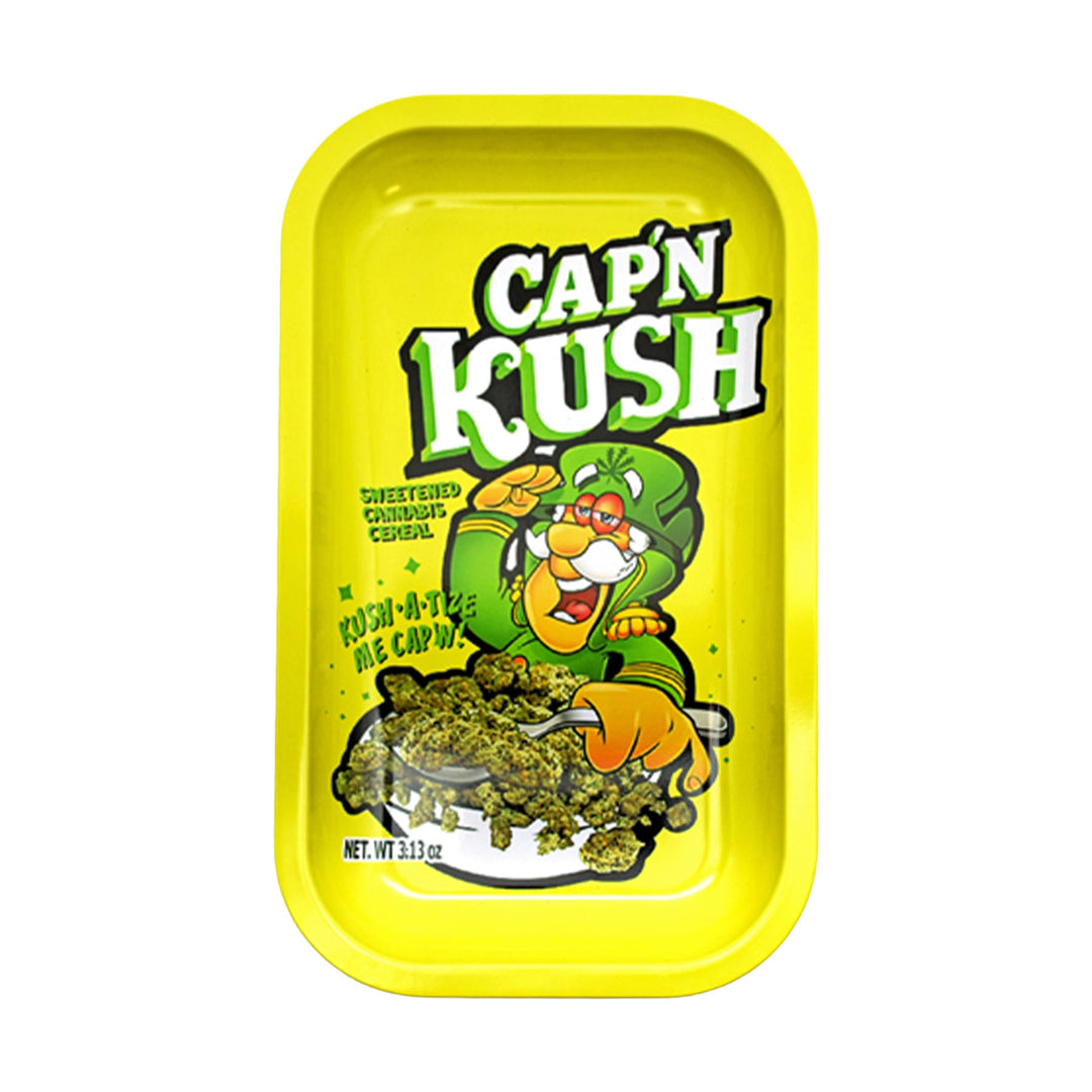 Bright yellow rounded metal rolling tray with bold Cap’n Kush lettering and colorful cartoon cannabis artwork.