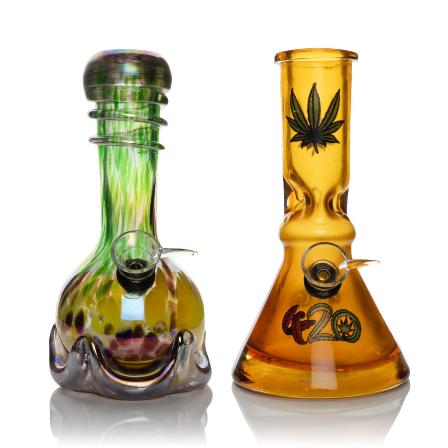 One green with a rounded base, one amber with a cannabis leaf design.