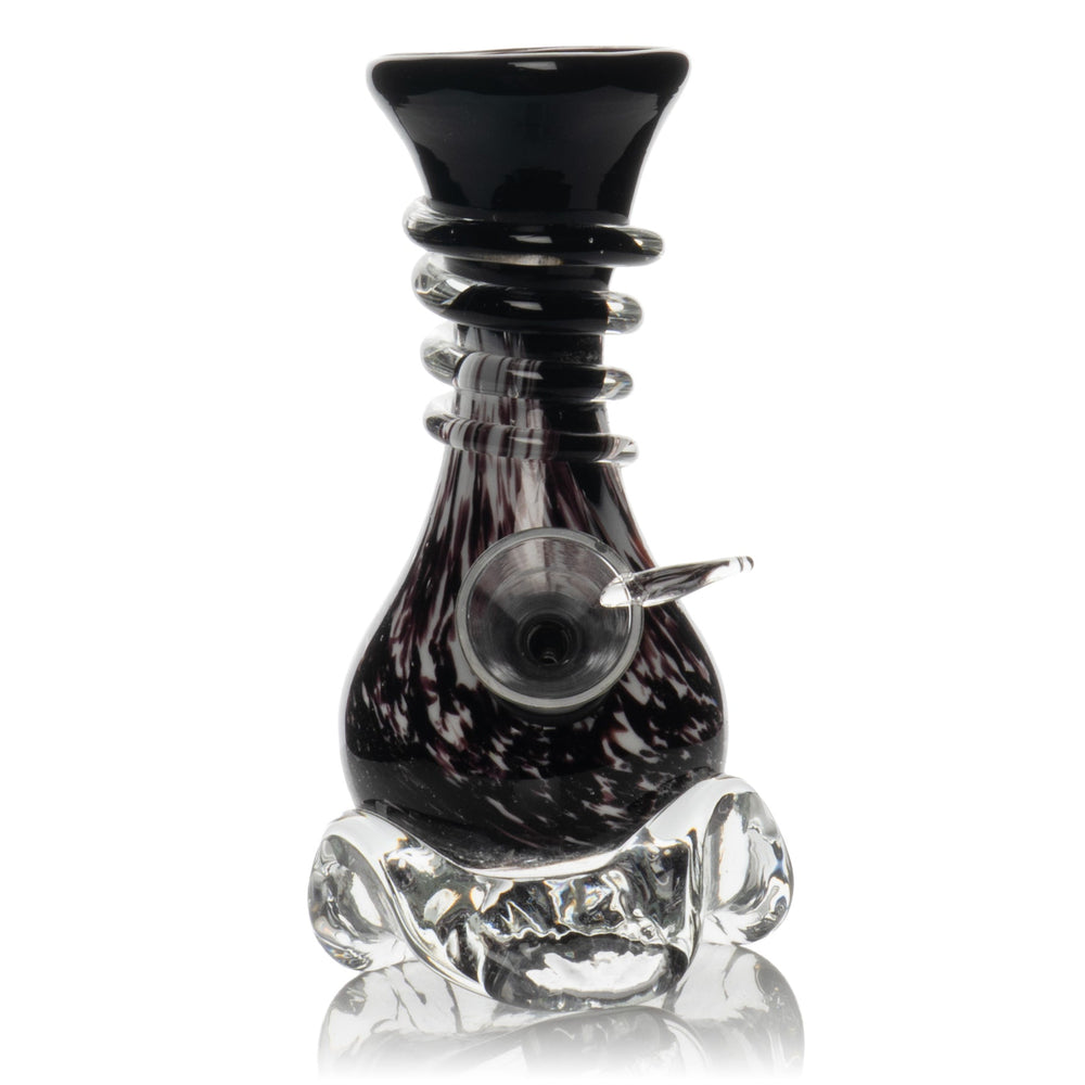 Compact black and clear glass Malta bong with a flared mouthpiece, patterned chamber, side bowl, and rounded base.